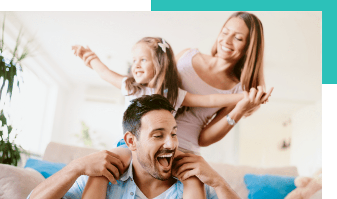 family smiles daughter on dads shoulders and mother holding her daughter hands